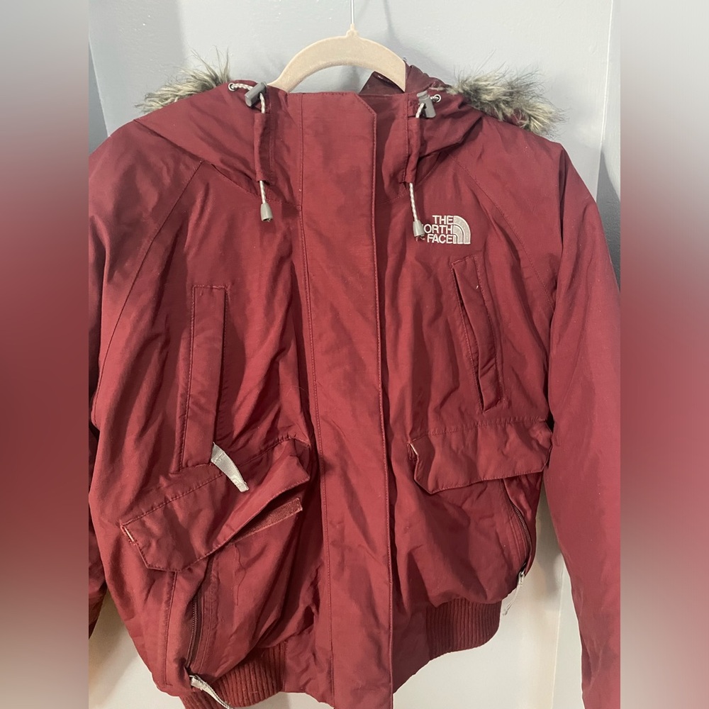 North face red bomber with faux fur women’s medium